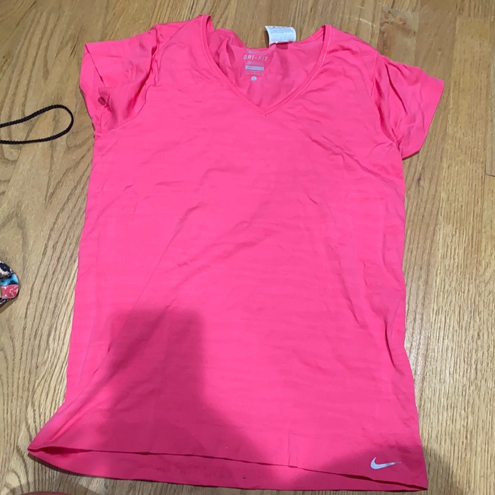 Pink drink-fit Nike shirt